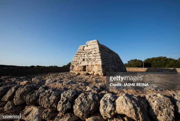 This photograph taken on June 22, 2023 shows the Naveta des Tudons, a prehistoric monument near Ciutadella on the island of Menorca. Human presence...