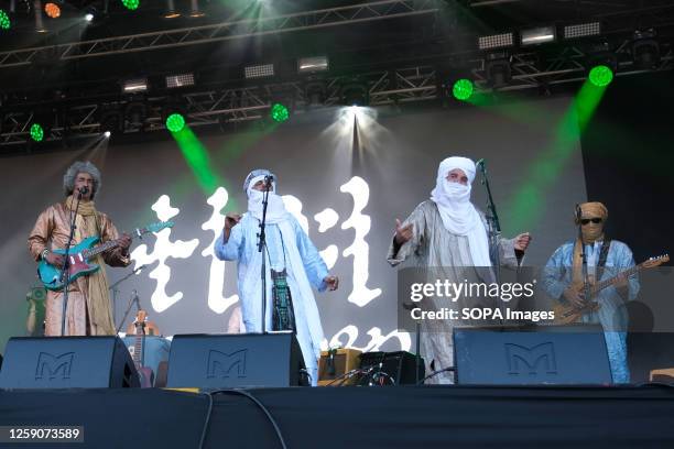 Ibrahim Ag Alhabib, Abdallah Ag Alhousseyni, Ibrahim Ag Alhabib, Eyadou Ag Leche with Tinariwen a collective of Tuareg musicians from the Sahara...