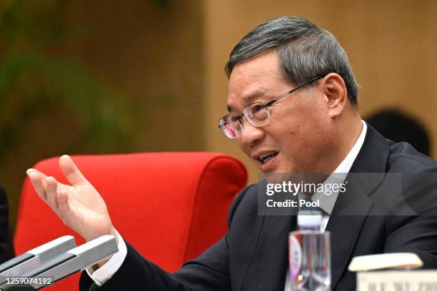 Chinese Premier Li Qiang speaks during meeting with Director-General of the World Trade Organization Ngozi Okonjo-Iweala ahead of the annual World...