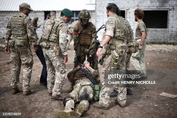 Ukraine Army recruits take part in a training session called "The battle of Innoculation training" with members of Britain's Royal Marines from the...