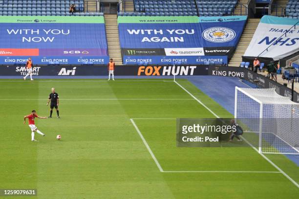 Bruno Fernandes of Manchester United scores the opening goal from the penalty spot during the Premier League match between Leicester City and...