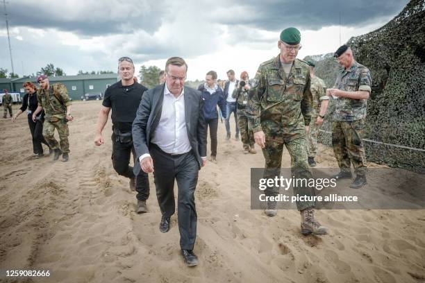 June 2023, Lithuania, Vilnius: Boris Pistorius , Federal Minister of Defense, Christian Nawrat, Brigadier General of the German Army, take part in...