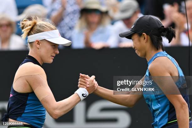 Britain's Harriet Dart shakes hands with China's Zhang Shuai after winning their women's singles round of 32 tennis match at the Rothesay Eastbourne...