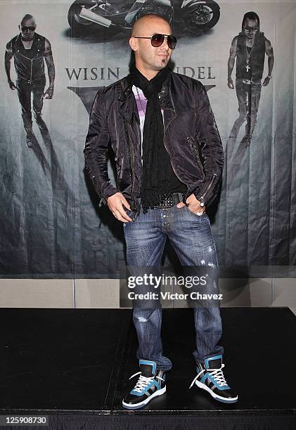 Singer Juan Luis Morera of Wisin Y Yandel attends a photocall to promote Wisin Y Yandel new album "Los Vaqueros El Regreso Deluxe Edition" at Hotel W...