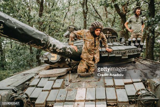 Ukrainian soldiers from Tank battalion of the 24th separate mechanized brigade named after king Danylo are seen with T-72 tank on positions near...