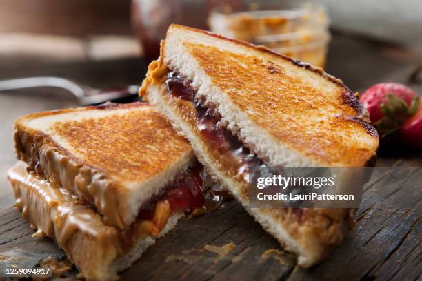 grilled peanut butter and strawberry jelly sandwich - peanut butter and jelly sandwich stock pictures, royalty-free photos & images