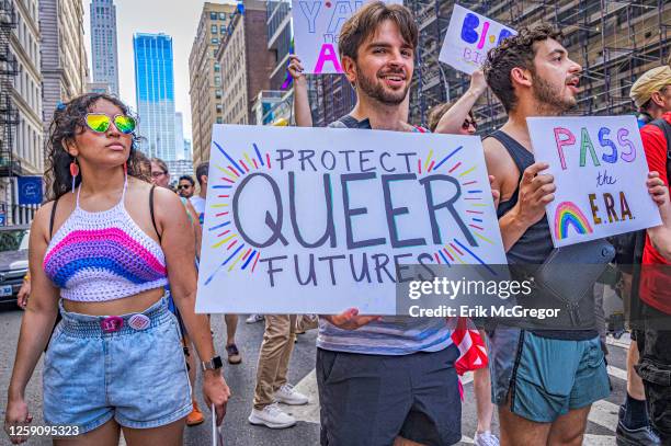 Participants seen holding signs at the march. Thousands of New Yorkers took to the streets of Manhattan to participate on the Reclaim Pride...