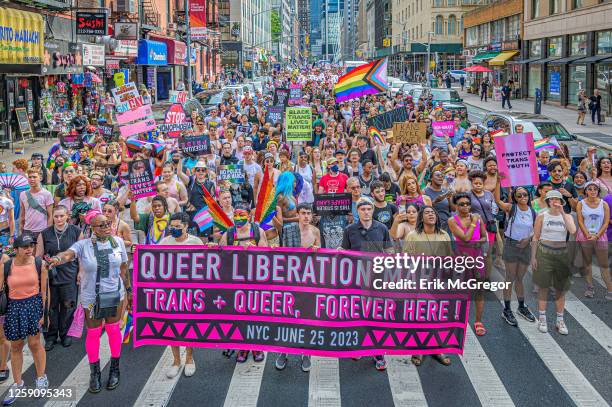 Participants seen holding a banner at the march. Thousands of New Yorkers took to the streets of Manhattan to participate on the Reclaim Pride...