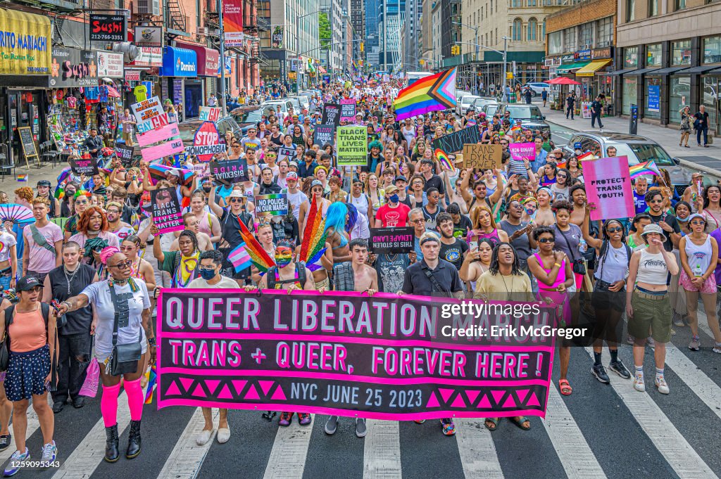 Participants seen holding a banner at the march. Thousands...