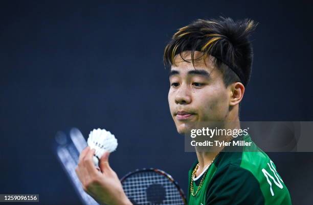 Tarnów , Poland - 26 June 2023; Nhat Nguyen of Ireland inspects the shuttlecock during his match against Milan Dratva of Slovakia in the badminton...