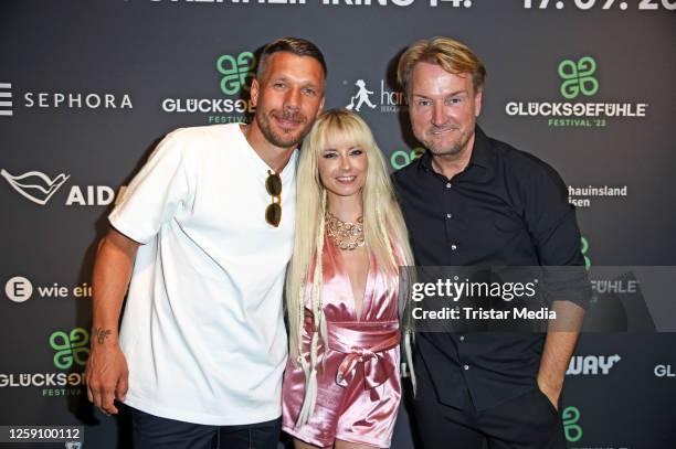 Lukas Podolski, Mia Julia Brückner and Markus Krampe during the "Glücksgefühle Festival Warm Up" at Hans im Glück am Ring on June 26, 2023 in...