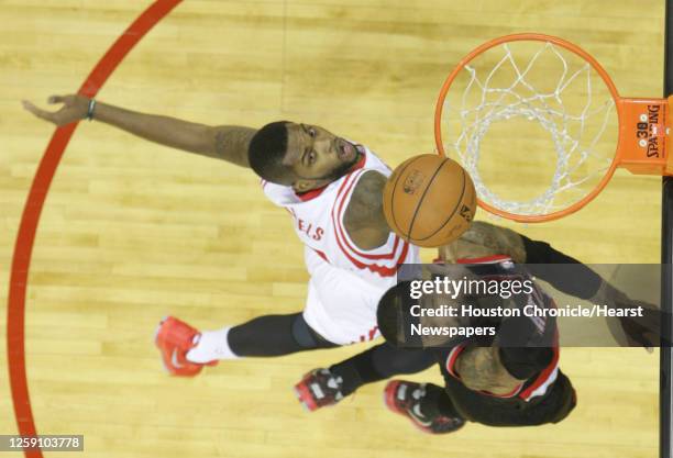 Portland Trail Blazers guard Mo Williams right, beats out Houston Rockets guard Troy Daniels left, to the basket during the first half game five of...