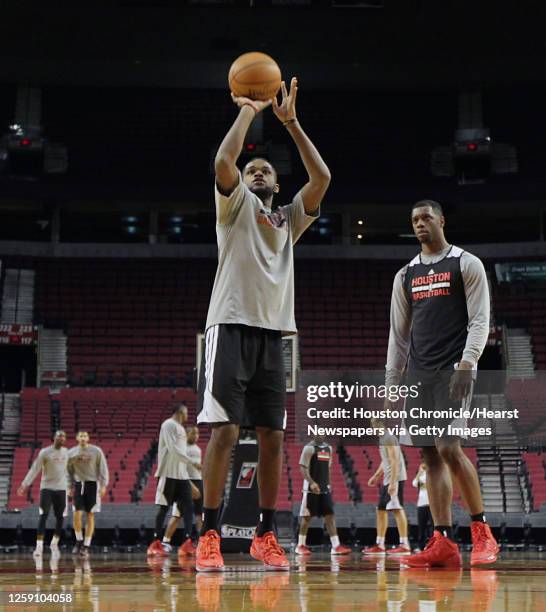 Houston Rockets guard Troy Daniels left, shoots the ball as Rockets forward Terrence Jones right, looks on during the Rockets practice session at the...