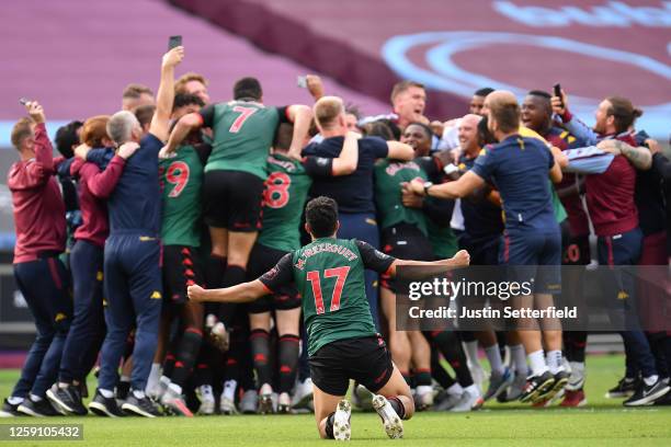 Trezeguet of Aston Villa celebrates as he finds out Aston Villa are staying in the Premier League at full-time after the Premier League match between...