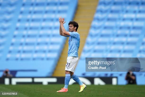 David Silva of Manchester City applauds as he is substituted during the Premier League match between Manchester City and Norwich City at Etihad...