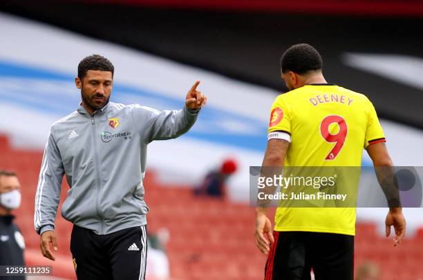 Hayden Mullins, Interim Manager of Watford talks with Troy Deeney of Watford during the Premier League match between Arsenal FC and Watford FC at...