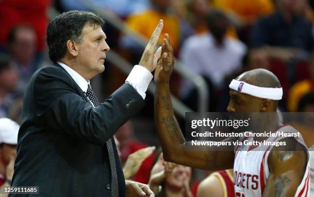 Houston Rockets head coach Kevin McHale and guard Jason Terry high five as Terry comes off the court during a time out during the third quarter of...