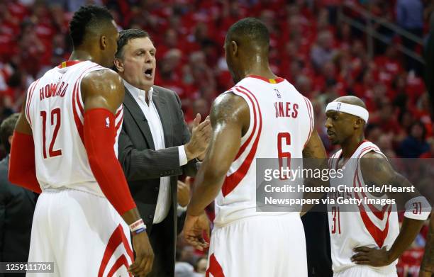 Houston Rockets head coach Kevin McHale works with center Dwight Howard , forward Terrence Jones and guard Jason Terry during a time out in the first...