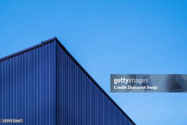 blue container against clear sky - blue cargo container stock pictures, royalty-free photos & images