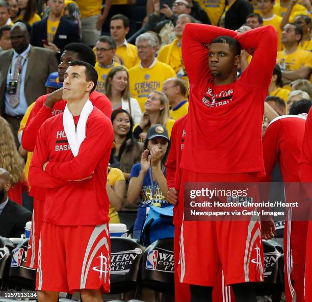 Houston Rockets guard Pablo Prigioni and forward Terrence Jones stand along the bench near the end of the fourth quarter of Game 5 of the NBA Western...