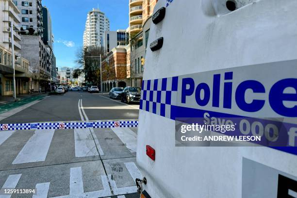 Police block off a street at Bondi Junction, an eastern suburb of Sydney on June 27, 2023 after a shooting incident. Australian police said a man was...