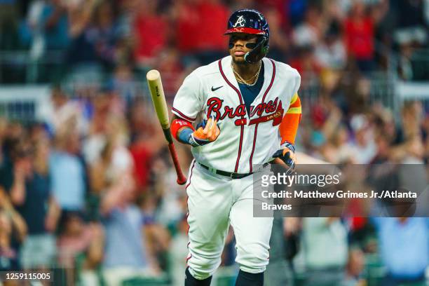 Ronald Acuña Jr. #13 of the Atlanta Braves flips his bat after hitting a home run in the seventh inning during the game against the Minnesota Twins...