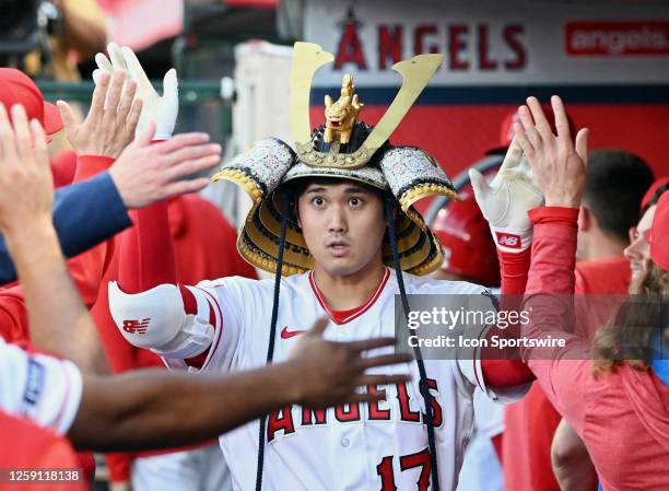 Los Angeles Angels designated hitter Shohei Ohtani in the dugout after hitting a solo home run in the fourth inning of an MLB baseball game against...