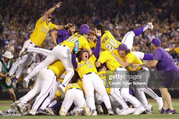 The LSU Tigers celebrate after defeating the Florida Gators in game three of the Division I Men's Baseball Championship held at Charles Schwab Field...