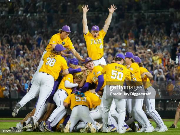 The LSU Tigers celebrate after winning the NCAA College World Series baseball finals against the Florida Gators at Charles Schwab Field on June 26,...