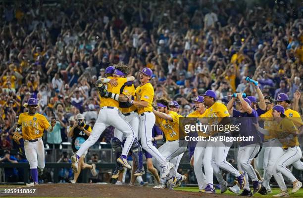 The LSU Tigers celebrate after winning the NCAA College World Series baseball finals against the Florida Gators at Charles Schwab Field on June 26,...