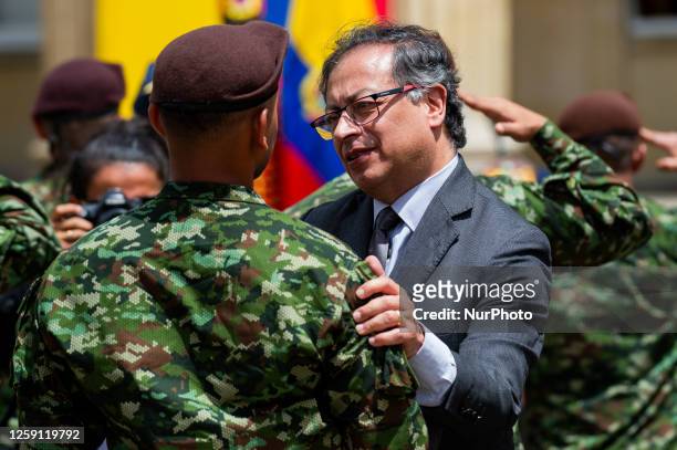 Colombian President Gustavo Petro gives honors and medals during the honors ceremony to soldiers and indigenous who helped the rescue of the children...