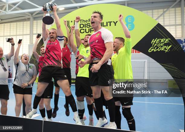 The Scorpions FC team celebrate winning after the Partially Sighted Cup Final between Merseyside Blind & V.I FC and FC 1-2 Scorpions FC at St...