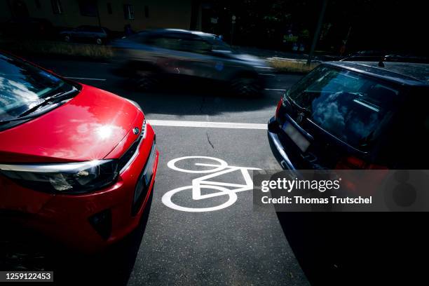 Cars are parked on a bike path in Ollenhauerstrasse in Berlin Reinickendorf on June 27, 2023 in Berlin, Germany. The new traffic administration in...