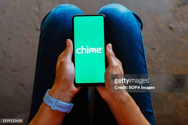 In this photo illustration, the Chime logo is displayed on a smartphone mobile screen.
