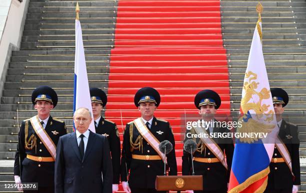 Russian President Vladimir Putin holds a minute of silence for pilots killed in clashes with the mutineers during a revolt by Wagner mercenaries as...