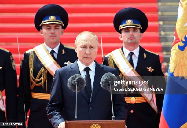 Russian President Vladimir Putin addresses troops from the defence ministry, National Guard, FSB security service and interior ministry gathered on...