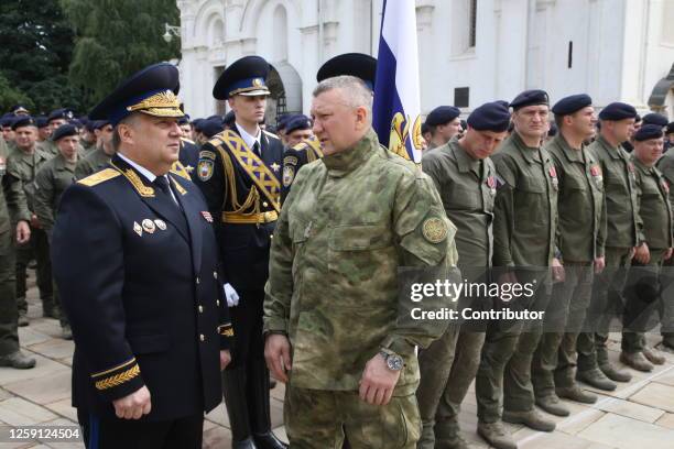 Russian Federal Protective Service Director Dmitry Kochnev talks to Presidenial Security Service Chief Alexei Rubezhnoy during a meeting with...