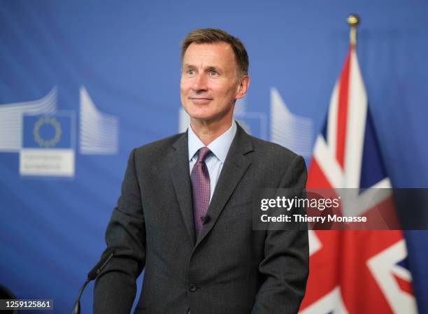 British Chancellor of the Exchequer Jeremy Hunt and the EU Commissioner for Financial services, financial stability and Capital Markets Union talk to...