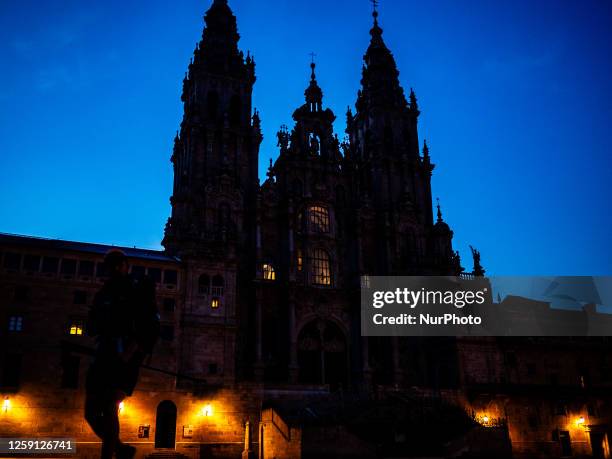 View of the cathedral of Santiago during sunrise, with the Plaza of the Obradoiro empty of pilgrims and tourists. On June 3rd, 2023.