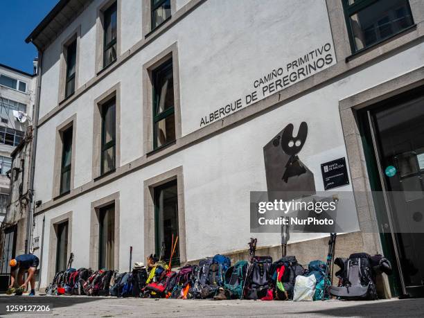 Lot of backpacks of pilgrims are seen placed next to the door of an albergue municipal in Galicia, Spain on the route of the Camino Primitivo. On May...