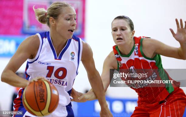 Russia's Ilona Korstin vies with Belarus's Natalia Veremeenko during their Group F qualifying round match in the Women's European Basketball...