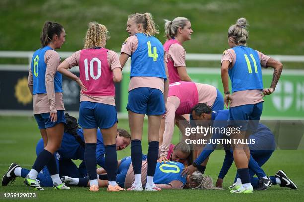 England's defender Alex Greenwood lays on the pitch following following a challenge during a team training session at St George's Park in...