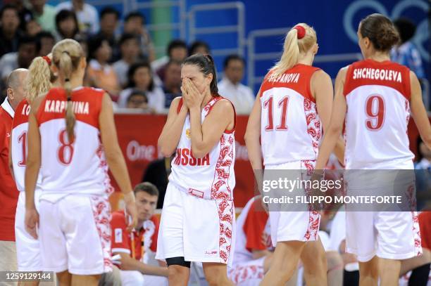 Russia's Ilona Korstin, Russia's Marina Karpunina, Russia's Svetlana Abrosimova, Russia's Maria Stepanova and Russia's Tatiana Shchegoleva react at...