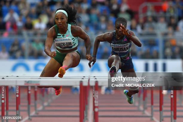 Puerto Rico's Jasmine Camacho-Quinn competes to win ahead of Nigeria's Tobi Amusan in the Women's 100m Hurdles event at the IAAF 2023 Golden Spike...