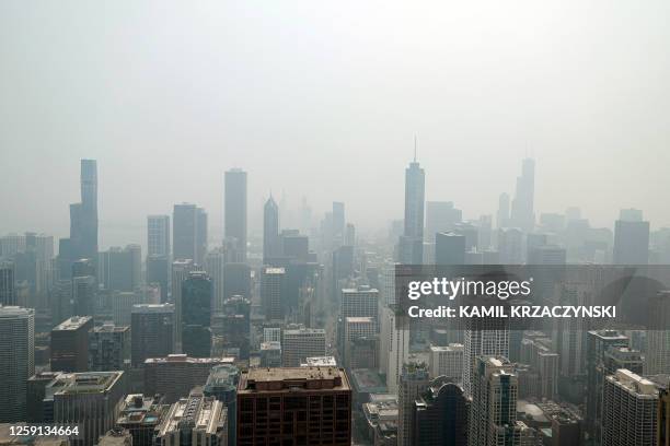 Chicago's skyline is seen from the 360 Chicago Observation Deck of the John Hancock Building with heavy smoke from the Canadian wildfires blanketing...