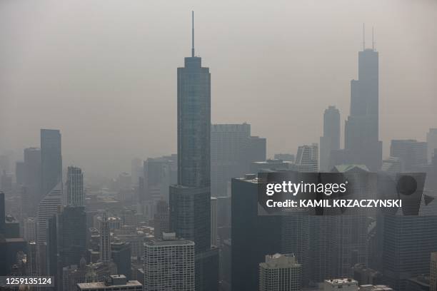 Chicago's skyline is seen from the 360 Chicago Observation Deck of the John Hancock Building with heavy smoke from the Canadian wildfires blanketing...