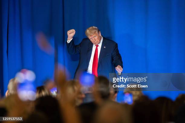 Republican presidential candidate, former U.S. President Donald Trump dances at the edge of the stage following his speech at the New Hampshire...