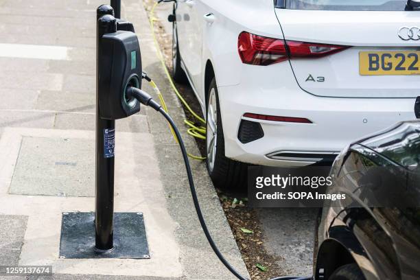 Cars are being charged at an electric charging point in Worthing. United Kingdom aims at banning sale of new petrol and diesel cars by 2030.