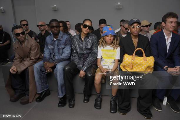 Rauw Alejandro, Stéphane Bak, Helen Lasichanh, Rocket Williams, and Pharrell Williams at the Loewe Spring 2024 Menswear Collection Runway Show at the...