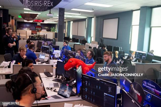 Team members monitor the capsule's operations during NASA's first major asteroid sample recovery rehearsal for its OSIRIS-REx mission, at Lockheed...